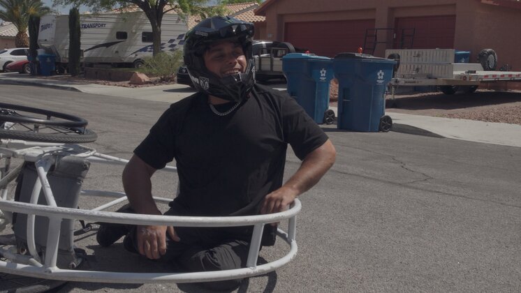 Aaron “Wheelz” Fotheringham with his invention the "rolly chair 3000", a giant metal wheel that allows him to do a full 360 spin.