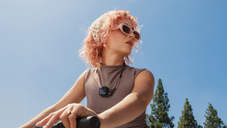 woman filming cycling pov with insta360 go ultra