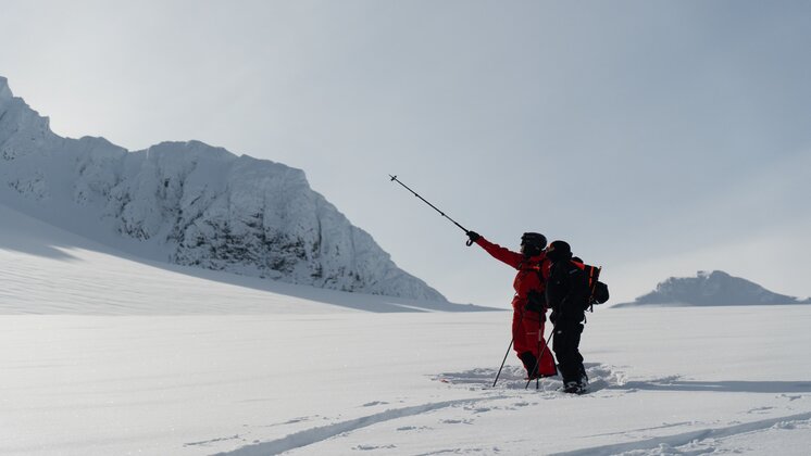 The Weger Brothers finding a new line to ski down on a snowy mountain.